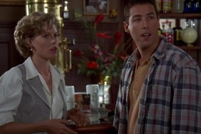 A woman and man stand at a bar.