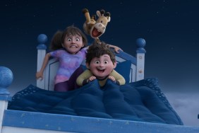 A girl and boy and horse in a bed.